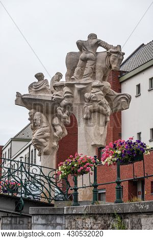 Gent, Flanders, Belgium - July 30, 2021: Beige Stone Statue Along Lieve River Called Brug Der Keizer