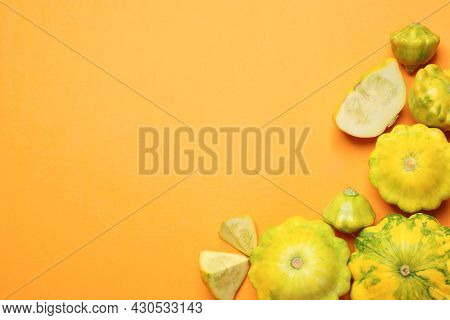 Fresh Ripe Pattypan Squashes On Orange Background, Flat Lay. Space For Text