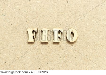 Alphabet Letter In Word Fifo (abbreviation Of First In First Out)  On Wood Background