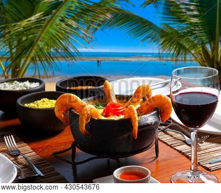 Shrimp and fish moqueca at a beachfront restaurant in Bahia