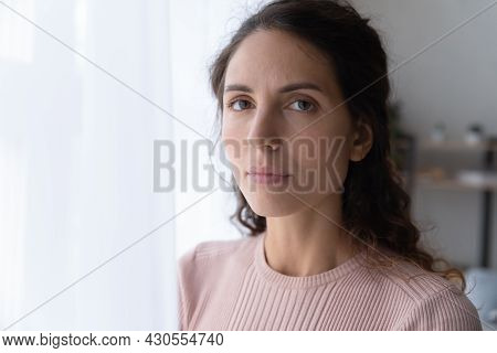 Close Up Portrait Of Serious Joyless Female