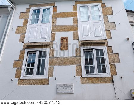 Mondonedo, Spain - August 08, 2021:
Marble Plaque And Portrait Marking A Home Of Writer,journalist A
