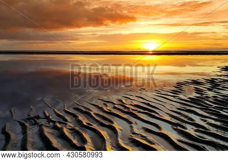 Beautiful Sunset Colors Over The Coastline Of Allerdale District In Cumbria, Uk. Sun Setting Over Th
