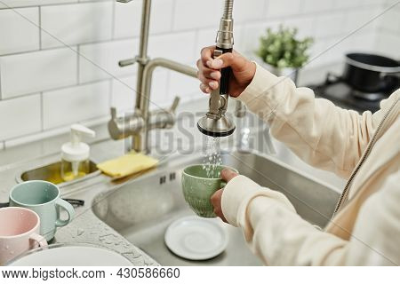 Close Up Of Young African-american Woman Washing Dishes At Home While Doing Chores On Weekend, Copy 