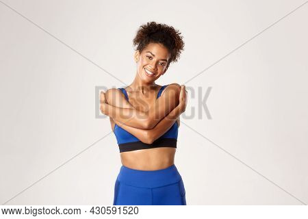 Concept Of Sport And Workout. Smiling Healthy African-american Female Athlete, Wearing Blue Sportswe