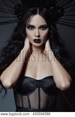 Halloween Theme: A Beautiful Young Witch. Dark Beauty: Portrait Of Seductive Goth Girl