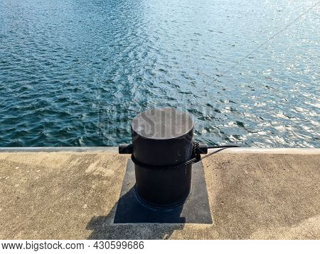Different Bollards In Front Of The Water At The Port Of Kiel.