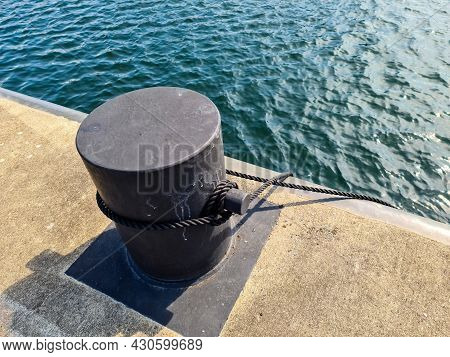 Different Bollards In Front Of The Water At The Port Of Kiel.