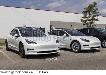 Indianapolis - Circa August 2021: Tesla Model 3 Ev Electric Vehicles On Display. Tesla Products Incl