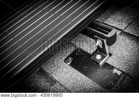 Rail, Bracket, And Anchor To A Solar Panel Installed On A Asphalt Shingle Roof