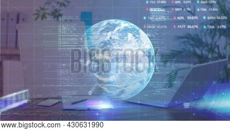 Digital composite image of stock market data processing over globe against office desk. global finance and business concept