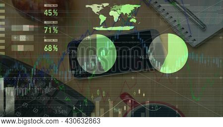 Digital composite image of financial data processing office equipment on office desk. global finance and business concept