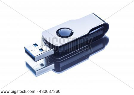 Flash Drive On A Light Mirror Surface With Reflection.
