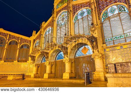 Central Market Of Valencia Illuminated In The Night . Mercado Central Public Market In Valencia Spai
