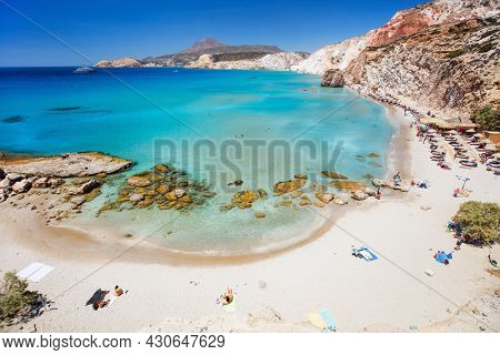 Idyllic Fyriplaka beach surrounded by beautiful cliffs on Greek island of Milos