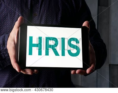 Manager Shows Hris Human Resource Information System On The Tablet.