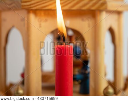 Burning Candles At The Christmas Pyramid. High Quality Photo