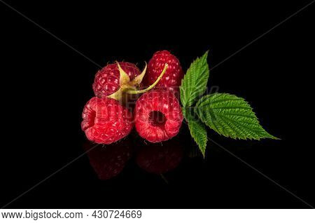 Raspberry Isolated. Raspberries With Leaf Isolate. Raspberry With Leaf Isolated On Black Background