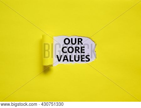 Our Core Values Symbol. Words 'our Core Values' Appearing Behind Torn Yellow Paper. Beautiful Yellow