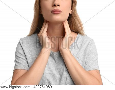 Young Woman Doing Thyroid Self Examination On White Background, Closeup
