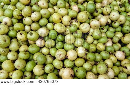 To Sell A Bunch Of Small Guava On The Street Market In India