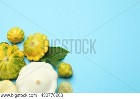 Fresh Ripe Pattypan Squashes On Light Blue Background, Flat Lay. Space For Text