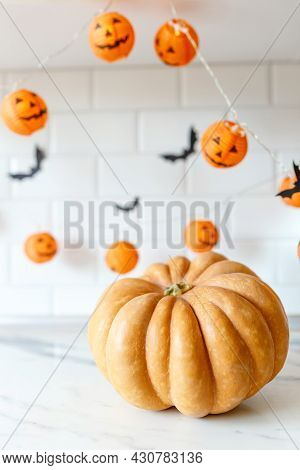 Halloween Pumpkin, Funny Jack Olantern On White Tile Kitchen Background, Creative Thanksgiving Conce