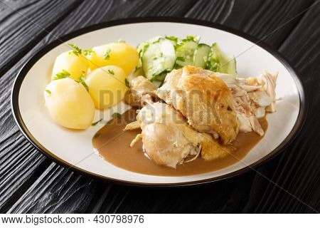 Danish Fried Old-fashioned Chicken With Boiled Potatoes And Cucumber Salad Close-up In A Plate On Th