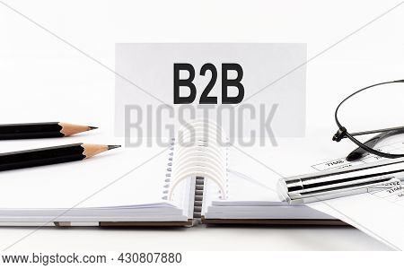 Text B2b On Paper Card,pen, Pencils, Glasses,financial Documentation On Table - Business