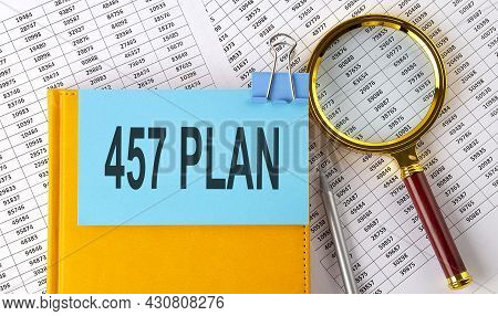 457 Plan Text On Sticker On Notebook With Magnifier And Chart. Business