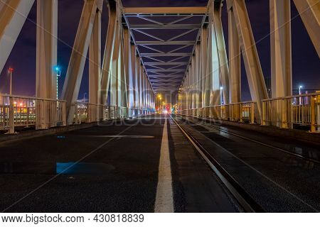Night View Of Illuminated Bridge Above Of River Scheldt In Antwerp, Belgium. High Quality Photo