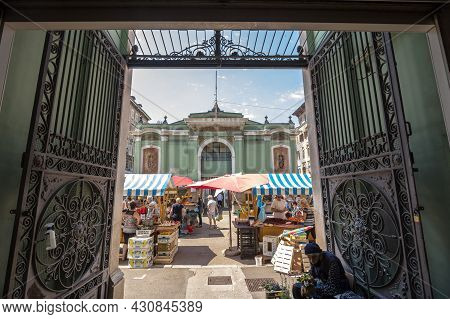 Rijeka, Croatia - June 18, 2021: Market Seller, Old Senior Merchan Woman  Selling Flowers In Front O
