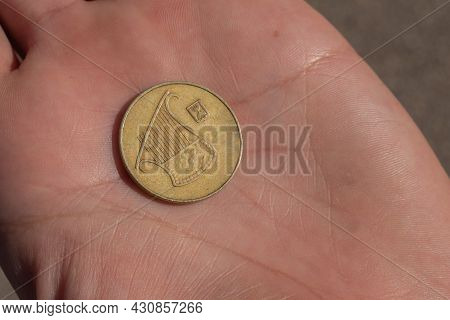 Modern Israeli Coin In The Hand. 0, 5 Sheqel. High Quality Photo