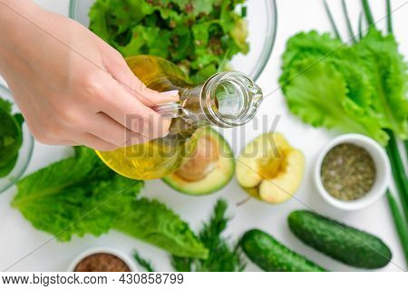 Woman Cooking Salad Of Fresh Green Vegetables And Herbs. Cooking Healthy Diet Or Vegetarian Food. Fe