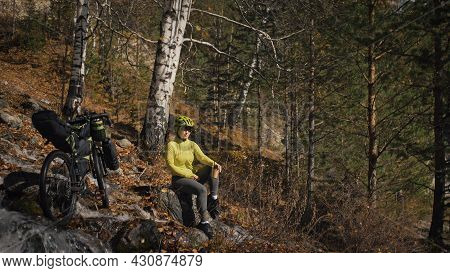 The Woman Travel On Mixed Terrain Cycle Touring With Bikepacking. The Traveler Journey With Bicycle 