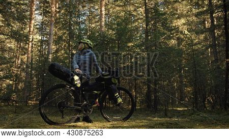 The Woman Travel On Mixed Terrain Cycle Touring With Bike Bikepacking. The Traveler Journey With Bic