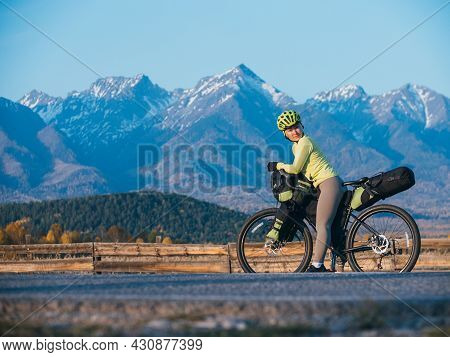 The Woman Travel On Mixed Terrain Cycle Touring With Bikepacking. The Traveler Journey With Bicycle 