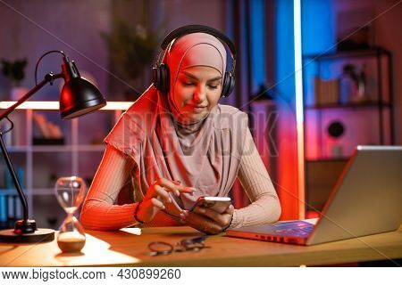 Leisure Concept, Break After Remote Work. Gorgeous Relaxed Young Arab Woman In Hijab, Enjoying Music