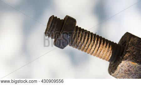 Old Rusty Bolt, Iron Rod With Screw Threads. Rusted Mechanical Components. Threaded Bolt And Nut Iso