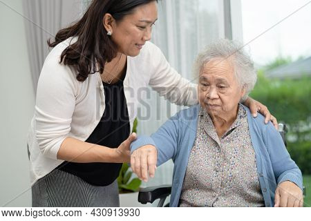 Help And Care Asian Senior Or Elderly Old Lady Woman Patient Sitting On Wheelchair At Nursing Hospit