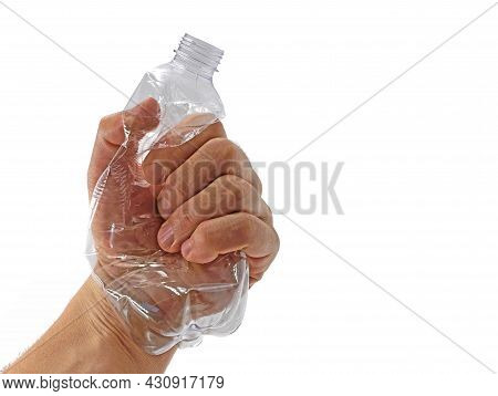 Male Hand Crushing Transparent Plastic Bottle With Copy Space, Fighting Against Plastic Pollution, R