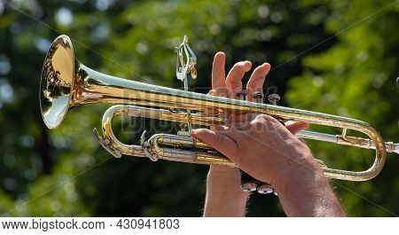 Playing A Brass Instrument. Military Band Performs At The Festival