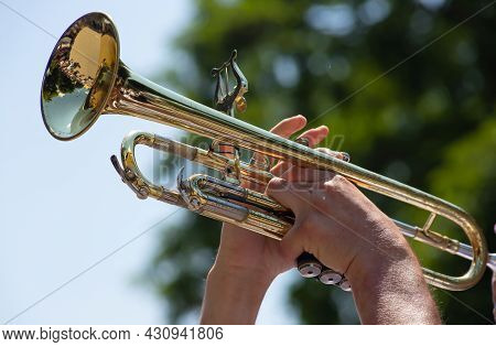 Playing A Brass Instrument. Military Band Performs At The Festival