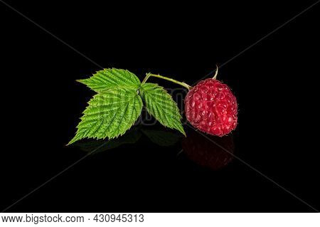 Raspberry Isolated. Raspberries With Leaf Isolate. Raspberry With Leaf Isolated On Black Background
