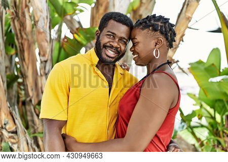 Young afircan american couple smiling happy and hugging at the city.
