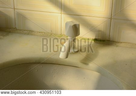 Closed Bathroom Plastic Faucet - Dramatic Image