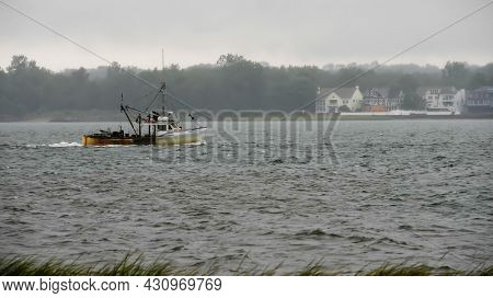 NORWALK, CONNECTICUT - AUGUST 23, 2021:    Nor'Easter oyster boat is returninf to Norwalk day after huricane Henri