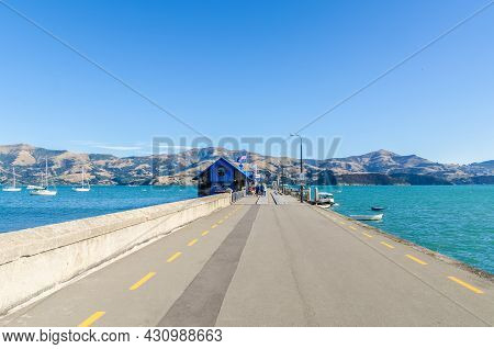 Akaroa,new Zealand - May 12,2016 : Jetty Pier Of Akaroa, South Island Of New Zealand. People Can See