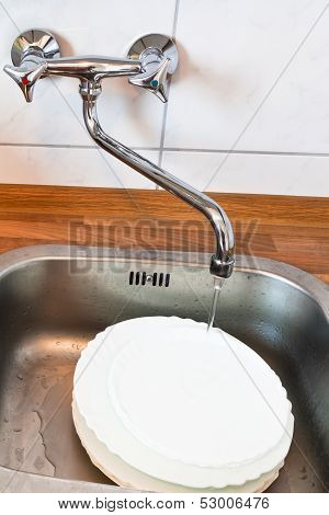 Washing-up In Metal Washbasin