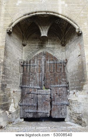 Main entry wooden gate of the Papal Palace in Avignon,France